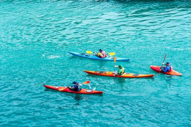 Teaching the sport of kayaking.